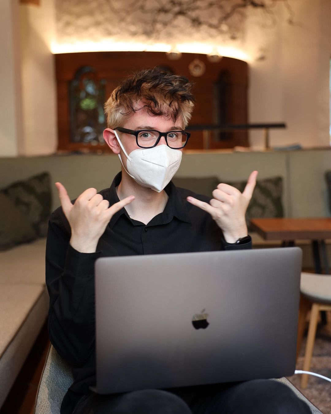 quinten behind laptop looking at camera